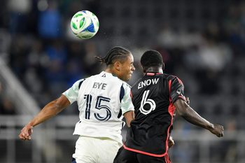 May 28, 2025; Washington, District of Columbia, USA; New England Revolution midfielder Brandon Bye (15) and D.C. United midfielder Boris Enow (6) go after the ball during the second half of the game at Audi Field. Mandatory Credit: Hannah Foslien-Imagn Images