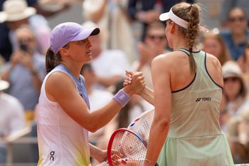 Jun 1, 2025; Paris, FR; Iga Swiatek of Poland at the net with Elena Rybakina of Kazakhstan after their match on day eight at Roland Garros Stadium. Mandatory Credit: Susan Mullane-Imagn Images