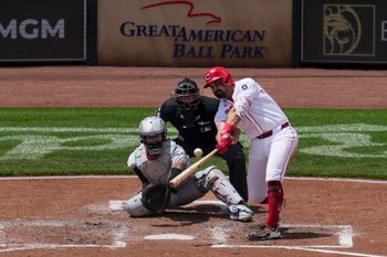 Jun 8, 2025; Cincinnati, Ohio, USA; Cincinnati Reds first baseman Christian Encarnacion-Strand (33) hits a solo home run against the Arizona Diamondbacks in the fourth inning at Great American Ball Park. Mandatory Credit: Aaron Doster-Imagn Images