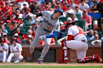 Jun 8, 2025; St. Louis, Missouri, USA;  Los Angeles Dodgers designated hitter Shohei Ohtani (17) reacts after he was hit by a pitch by St. Louis Cardinals relief pitcher Matt Svanson (not pictured) during the eighth inning at Busch Stadium. Mandatory Credit: Jeff Curry-Imagn Images
