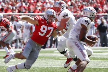 Ohio State Buckeyes defensive lineman Nick Bosa (97) chases down UNLV Rebels quarterback Armani Rogers (1) under pressure from UNLV Rebels offensive lineman Kyle Saxelid, center, during the second quarter of a NCAA college football game between the Ohio State Buckeyes and the UNLV Rebels on Saturday, September 23, 2017 at Ohio Stadium in Columbus, Ohio. [Joshua A. Bickel/Dispatch]

1013108925 Oh Col Osufb