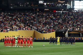 Jul 5, 2025; Atlanta, Georgia, USA; FC Bayern Munich and Paris Saint-Germain stand on the field during the moment of silence for Liverpool forward Diogo Jota and his brother Andre Silva before a quarterfinal match of the 2025 FIFA Club World Cup at Mercedes-Benz Stadium. Mandatory Credit: Brett Davis-Imagn Images