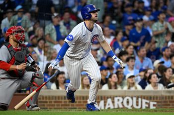 Jul 6, 2025; Chicago, Illinois, USA;  Chicago Cubs outfielder Kyle Tucker (30) hits an RBI sacrifice fly ball during the third inning against the St. Louis Cardinals at Wrigley Field. Mandatory Credit: Matt Marton-Imagn Images