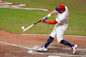 Jul 15, 2025; Cumberland, Georgia, USA; National League designated hitter Kyle Schwarber (12) of the Philadelphia Phillies hits a home run in the swing off of after the  2025 MLB All Star Game ended in a tie at Truist Park. Mandatory Credit: Dale Zanine-Imagn Images