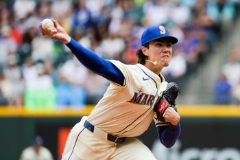 Jul 20, 2025; Seattle, Washington, USA; Seattle Mariners starting pitcher Bryan Woo (22) throws against the Houston Astros during the second inning at T-Mobile Park. Mandatory Credit: Joe Nicholson-Imagn Images