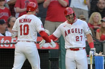 Jul 28, 2025; Anaheim, California, USA;  Los Angeles Angels third baseman Kevin Newman (10) is congratulated by designated hitter Mike Trout (27) after hitting a two-run home run during the third inning against the Texas Rangers at Angel Stadium. Mandatory Credit: Jayne Kamin-Oncea-Imagn Images