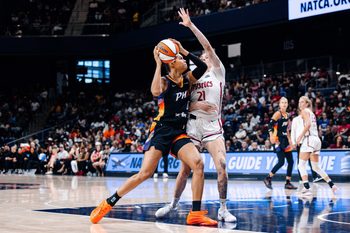 Jul 27, 2025; Washington, District of Columbia, USA; Phoenix Mercury forward Satou Sabally (0) prepares to shoot the ball while Washington Mystics forward Emily Engstler (21) defends in the second half at CareFirst Arena. Mandatory Credit: Emily Faith Morgan-Imagn Images