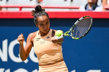 Jul 29, 2025; Montreal, QC, Canada; Leylah Fernandez (CAN) returns the ball to Maya Joint (AUS) in first round play at IGA Stadium. Mandatory Credit: David Kirouac-Imagn Images