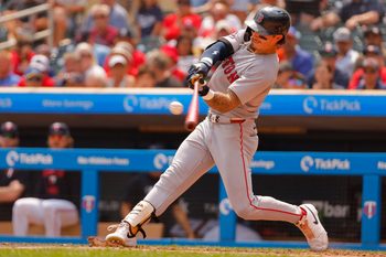 Jul 30, 2025; Minneapolis, Minnesota, USA; Boston Red Sox center fielder Jarren Duran (16) hits a two run home run against the Minnesota Twins in the sixth inning at Target Field. Mandatory Credit: Bruce Kluckhohn-Imagn Images