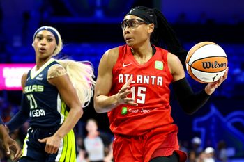 Jul 30, 2025; Arlington, Texas, USA;  Atlanta Dream guard Allisha Gray (15) drives to the basket past Dallas Wings guard DiJonai Carrington (21) during the first half at College Park Center. Mandatory Credit: Kevin Jairaj-Imagn Images