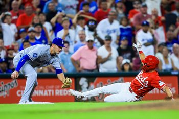 Jul 30, 2025; Cincinnati, Ohio, USA; Cincinnati Reds first baseman Spencer Steer (7) slides into third after hitting a two-run triple in the eighth inning against the Los Angeles Dodgers at Great American Ball Park. Mandatory Credit: Katie Stratman-Imagn Images