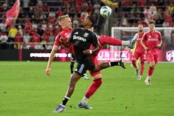 Jul 30, 2025; St. Louis, Missouri, USA; St. Louis City defender Timo Baumgartl (32) and Aston Villa defender Ian Maatsen (22) battle for the ball in the first half at Energizer Park. Mandatory Credit: Joe Puetz-Imagn Images