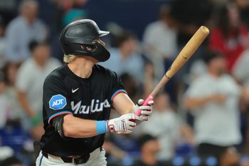 Aug 1, 2025; Miami, Florida, USA; Miami Marlins left fielder Kyle Stowers (28) hits a grand slam against the New York Yankees seventh inning at loanDepot Park. Mandatory Credit: Sam Navarro-Imagn Images