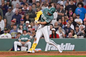 Aug 1, 2025; Boston, Massachusetts, USA; Boston Red Sox left fielder Roman Anthony (19) hits a game winning RBI against the Houston Astros during the tenth inning inning at Fenway Park. Mandatory Credit: Eric Canha-Imagn Images