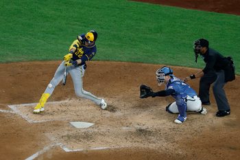 Aug 1, 2025; Washington, District of Columbia, USA; Milwaukee Brewers outfielder Christian Yelich (22) hits an RBI single against the Washington Nationals during the fifth inning at Nationals Park. Mandatory Credit: Geoff Burke-Imagn Images