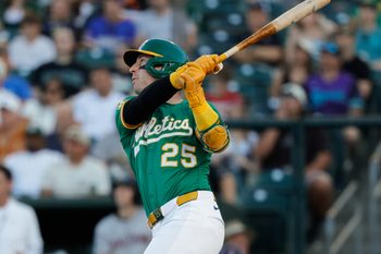 Aug 1, 2025; West Sacramento, California, USA; Athletics designated hitter Brent Rooker (25) hits an RBI sac fly during the first inning against the Arizona Diamondbacks at Sutter Health Park. Mandatory Credit: Sergio Estrada-Imagn Images