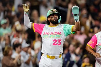 Aug 1, 2025; San Diego, California, USA; San Diego Padres right fielder Fernando Tatis Jr. (23) scores on a two-RBI single from center fielder Jackson Merrill (3) during the fifth inning against the St. Louis Cardinals at Petco Park. Mandatory Credit: Chadd Cady-Imagn Images