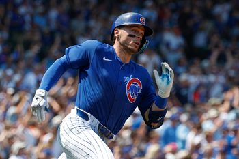 Aug 2, 2025; Chicago, Illinois, USA; Chicago Cubs shortstop Nico Hoerner  wearing number 23 in honor the late Hall of Fame second baseman Ryne Sandberg runs after hitting an RBI-ground rule double against the Baltimore Orioles during the second inning at Wrigley Field. Mandatory Credit: Kamil Krzaczynski-Imagn Images