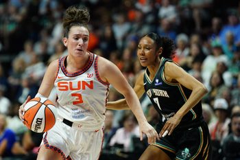 Aug 3, 2025; Uncasville, Connecticut, USA; Connecticut Sun guard Marina Mabrey (3) drives the ball against New York Liberty guard Rebekah Gardner (7) in the first half at Mohegan Sun Arena. Mandatory Credit: David Butler II-Imagn Images