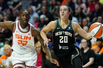 Aug 3, 2025; Uncasville, Connecticut, USA; New York Liberty guard Sabrina Ionescu (20) drives the ball against Connecticut Sun guard Saniya Rivers (22) in the second half at Mohegan Sun Arena. Mandatory Credit: David Butler II-Imagn Images