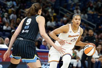 Aug 3, 2025; Chicago, Illinois, USA; Phoenix Mercury forward Alyssa Thomas (25) brings the ball up court against Chicago Sky guard Rebecca Allen (9) during the first half at Wintrust Arena. Mandatory Credit: Kamil Krzaczynski-Imagn Images