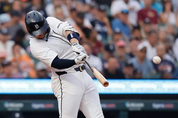 Aug 4, 2025; Detroit, Michigan, USA;  Detroit Tigers first baseman Spencer Torkelson (20) hits a single in the sixth inning against the Minnesota Twins at Comerica Park. Mandatory Credit: Rick Osentoski-Imagn Images
