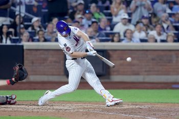 Aug 4, 2025; New York City, New York, USA; New York Mets designated hitter Pete Alonso (20) hits an RBI single against the Cleveland Guardians during the eighth inning at Citi Field. Mandatory Credit: Brad Penner-Imagn Images