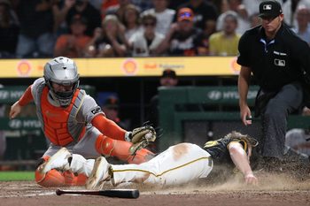 Aug 4, 2025; Pittsburgh, Pennsylvania, USA;  Pittsburgh Pirates right fielder Jack Suwinski (right) slides past San Francisco Giants catcher Patrick Bailey (14) to score the game winning run during the ninth inning at PNC Park. Mandatory Credit: Charles LeClaire-Imagn Images