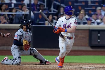 Aug 4, 2025; New York City, New York, USA; New York Mets third baseman Brett Baty (7) follows through on an RBI single against the Cleveland Guardians during the tenth inning at Citi Field. Mandatory Credit: Brad Penner-Imagn Images