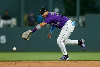 Aug 4, 2025; Denver, Colorado, USA; Colorado Rockies second baseman Thairo Estrada (39) is unable to field the ball in the ninth inning against the Toronto Blue Jays at Coors Field. Mandatory Credit: Isaiah J. Downing-Imagn Images