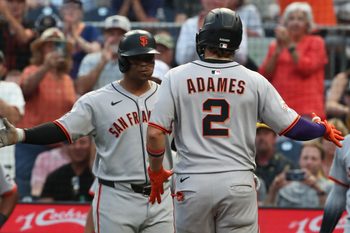 Aug 5, 2025; Pittsburgh, Pennsylvania, USA;  San Francisco Giants designated hitter Rafael Devers (left) greets shortstop Willy Adames (2) crossing home plate on on a two run home run against the Pittsburgh Pirates during the fifth inning at PNC Park. Mandatory Credit: Charles LeClaire-Imagn Images