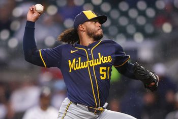 Aug 5, 2025; Atlanta, Georgia, USA; Milwaukee Brewers starting pitcher Freddy Peralta (51) throws against the Atlanta Braves in the third inning at Truist Park. Mandatory Credit: Brett Davis-Imagn Images