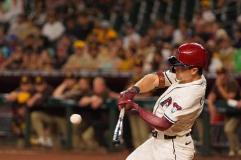 Aug 5, 2025; Phoenix, Arizona, USA; Arizona Diamondbacks outfielder Corbin Carroll (7) at bat in the third inning against the San Diego Padres at Chase Field. Mandatory Credit: Allan Henry-Imagn Images