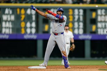 Aug 5, 2025; Denver, Colorado, USA; Toronto Blue Jays first baseman Vladimir Guerrero Jr. (27) reacts from second on an RBI double in the ninth inning against the Colorado Rockies at Coors Field. Mandatory Credit: Isaiah J. Downing-Imagn Images