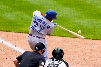 Aug 6, 2025; Denver, Colorado, USA; Toronto Blue Jays first base Vladimir Guerrero Jr. (27) doubles in the ninth inning against the Colorado Rockies at Coors Field. Mandatory Credit: Ron Chenoy-Imagn Images