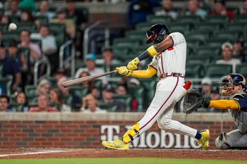 Aug 6, 2025; Cumberland, Georgia, USA; Atlanta Braves outfielder Jurickson Profar (7) hits a home run against the Milwaukee Brewers during the sixth inning at Truist Park. Mandatory Credit: Dale Zanine-Imagn Images