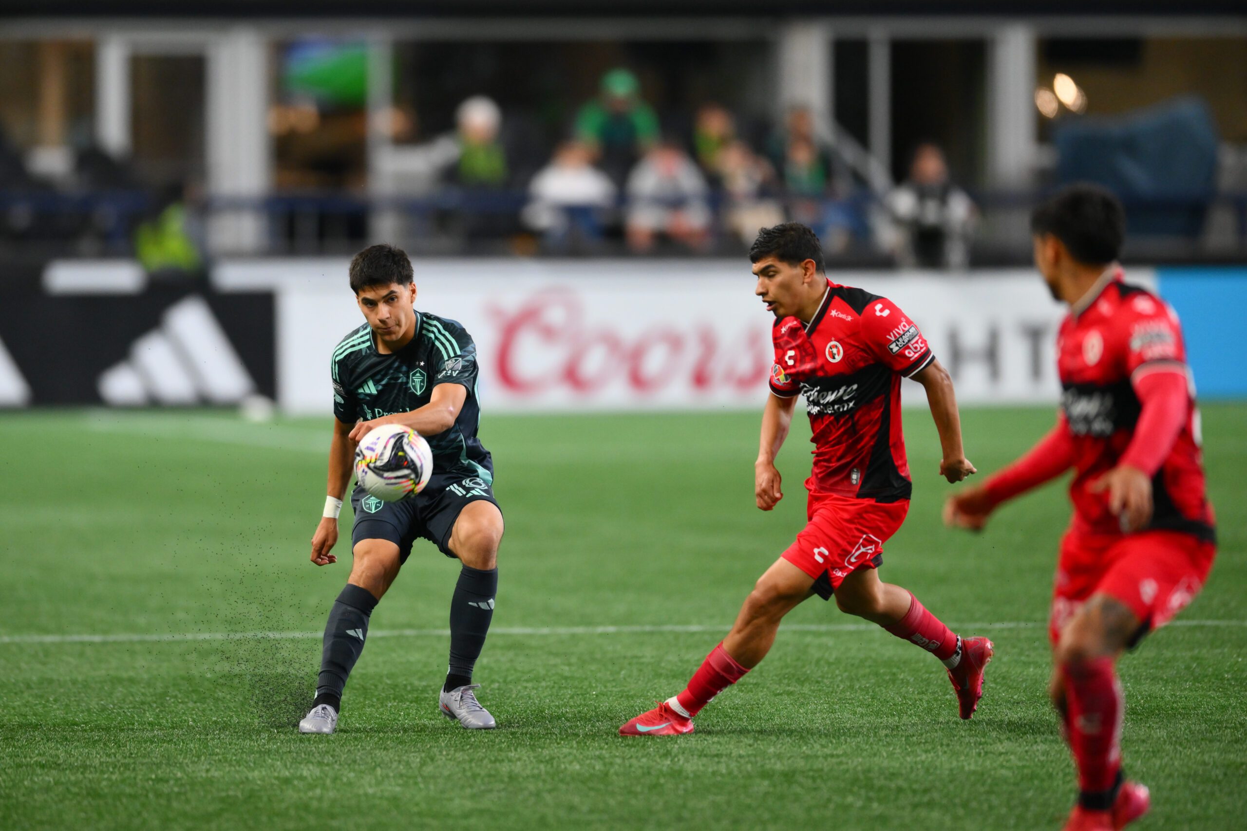 Aug 6, 2025; Seattle, WA, USA; Seattle Sounders FC midfielder Obed Vargas (18) passes the ball against Tijuana during the second half at Lumen Field. Mandatory Credit: Steven Bisig-Imagn Images