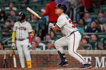 Aug 7, 2025; Cumberland, Georgia, USA; Atlanta Braves catcher Drake Baldwin (30) hits a three run home run against the Miami Marlins during the eighth inning at Truist Park. Mandatory Credit: Dale Zanine-Imagn Images