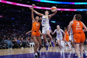 Aug 7, 2025; Los Angeles, California, USA; LA Sparks guard Kelsey Plum (10) goes up for a shot while defended by Connecticut Sun center Olivia Nelson-Ododa (10) in the second half at Crypto.com Arena. Mandatory Credit: Kirby Lee-Imagn Images