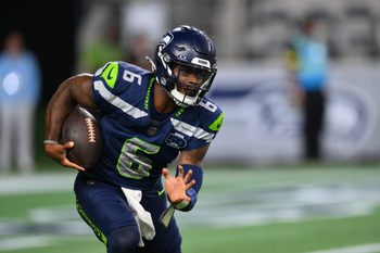 Aug 7, 2025; Seattle, Washington, USA; Seattle Seahawks quarterback Jalen Milroe (6) carries the ball against the Las Vegas Raiders during the second half at Lumen Field. Mandatory Credit: Steven Bisig-Imagn Images