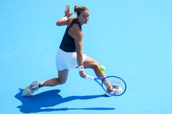 Aug 8, 2025; Cincinnati, OH, USA; Maria Sakkari (GRE) returns a shot against Kamilla Rakhimova (RUS) during the Cincinnati Open at the Lindner Family Tennis Center. Mandatory Credit: Aaron Doster-Imagn Images