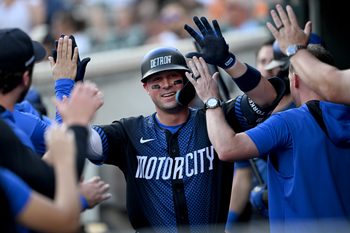 Aug 8, 2025; Detroit, Michigan, USA;  Detroit Tigers first base Spencer Torkelson (20)  celebrates in the dugout after hitting a solo home run against the Los Angeles Angels in the second inning at Comerica Park. Mandatory Credit: Lon Horwedel-Imagn Images