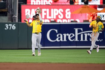 Aug 8, 2025; Baltimore, Maryland, USA; Oakland Athletics third baseman Darell Hernaiz (2) makes a catch for an out during the eighth inning against the Oakland Athletics at Oriole Park at Camden Yards. Mandatory Credit: Daniel Kucin Jr.-Imagn Images