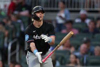 Aug 8, 2025; Cumberland, Georgia, USA; Miami Marlins left fielder Kyle Stowers (28) walks and tosses his bat against the Atlanta Braves during the fifth inning at Truist Park. Mandatory Credit: Mady Mertens-Imagn Images