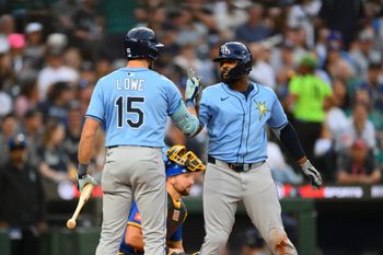 Aug 8, 2025; Seattle, Washington, USA; Tampa Bay Rays right fielder Josh Lowe (15) and third baseman Junior Caminero (13) celebrate after Caminero hit a home run against the Seattle Mariners during the sixth inning at T-Mobile Park. Mandatory Credit: Steven Bisig-Imagn Images