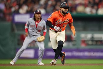Aug 8, 2025; San Francisco, California, USA; San Francisco Giants left fielder Heliot Ramos (17) and Washington Nationals shortstop CJ Abrams (5) watch game play during the seventh inning at Oracle Park. Mandatory Credit: Robert Edwards-Imagn Images