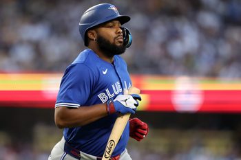 Aug 9, 2025; Los Angeles, California, USA;  Toronto Blue Jays designated hitter Vladimir Guerrero Jr. (27) reacts  during the fifth inning against the Los Angeles Dodgers at Dodger Stadium. Mandatory Credit: Kiyoshi Mio-Imagn Images