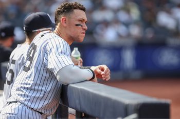 Aug 10, 2025; Bronx, New York, USA;  New York Yankees designated hitter Aaron Judge (99) watches from the dugout in the ninth inning against the Houston Astros at Yankee Stadium. Mandatory Credit: Wendell Cruz-Imagn Images