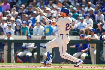 Aug 10, 2025; Seattle, Washington, USA; Seattle Mariners designated hitter Cal Raleigh (29) hits a two-run home run against the Tampa Bay Rays during the first inning at T-Mobile Park. Mandatory Credit: Joe Nicholson-Imagn Images
