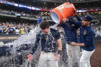 Aug 10, 2025; Milwaukee, Wisconsin, USA; Milwaukee Brewers left fielder Isaac Collins (6) gets a postgame dunk after hitting a walkoff home run against the New York Mets at American Family Field. Mandatory Credit: Benny Sieu-Imagn Images